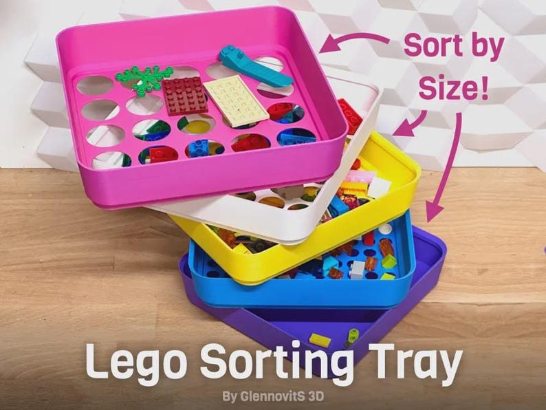 May include: Stack of colorful Lego sorting trays in pink, white, yellow, blue, and purple. Each tray contains Lego bricks of various colors and shapes. Text on the image reads "Lego Sorting Tray" and "Sort by Size!"