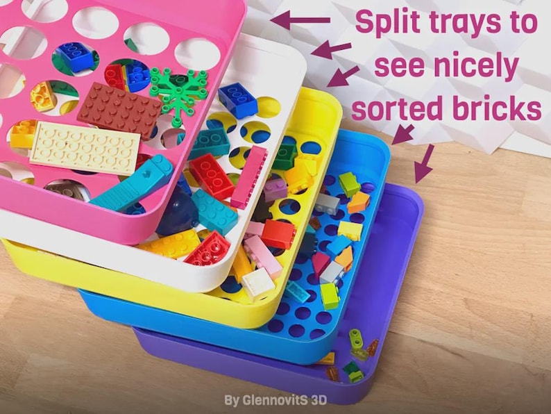 May include: Stack of colorful plastic trays filled with assorted toy bricks. The trays are pink, white, yellow, blue, and purple. Text on the image reads "Split trays to see nicely sorted bricks."