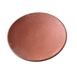 May include: A circular, terracotta-coloured plate with a slightly uneven edge. The plate has a matte finish and a smooth surface. The colour is a warm, earthy tone, suitable for serving food.
