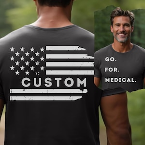 May include: A black t-shirt with a distressed white American flag design and the word "CUSTOM" printed below it. The back of the shirt features the text "GO. FOR. MEDICAL."