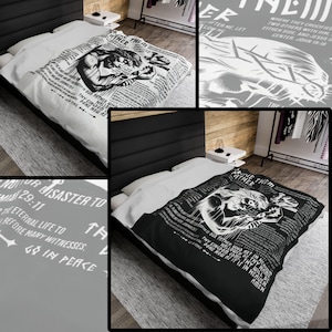 May include: Black and white throw blanket featuring a graphic of Jesus Christ and text from the Bible. The text includes "Forgive them Father, for they know not what they do." and "Thy Kingdom come, Thy will be done now and forever. Amen."