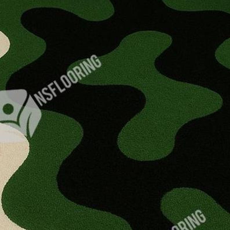 May include: A close-up of a camouflage pattern in shades of green and black. The pattern has a wavy, organic design. The text "NSFLOORING" is visible in the upper left corner. The overall theme is flooring or surface design.