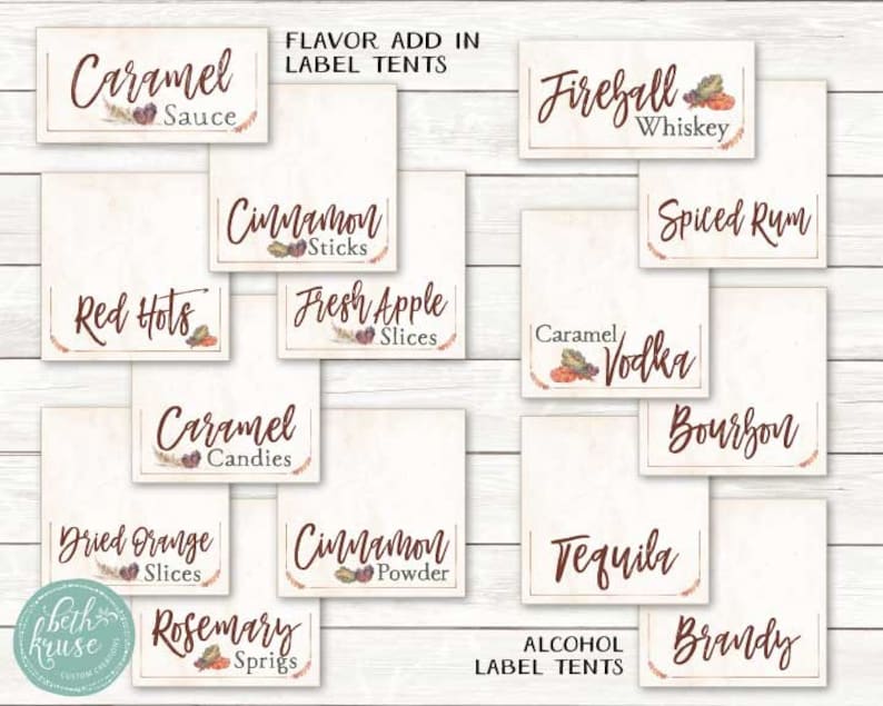 May include: A set of printable labels for a fall-themed party. The labels are designed to be used as tent cards for a variety of drinks and flavor add-ins. The labels feature a rustic, autumnal design with brown and red accents. The labels include text such as "Caramel Sauce", "Cinnamon Sticks", "Red Hots", "Fresh Apple Slices", "Fireball Whiskey", "Spiced Rum", "Caramel Vodka", "Bourbon", "Tequila", "Brandy", "Dried Orange Slices", "Cinnamon Powder", and "Rosemary Sprigs".
