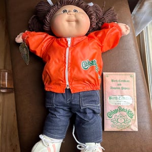Cabbage Patch Kids original doll 1983 brown eyes brown hair NEW with Birth certificate . Orange Jacket Denim pants jeans shoes no box