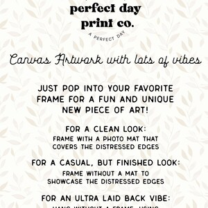 May include: A beige canvas print featuring the text "perfect day print co." and "Canvas Artwork with lots of vibes." The print also includes framing instructions. A delicate leaf pattern adorns the background.