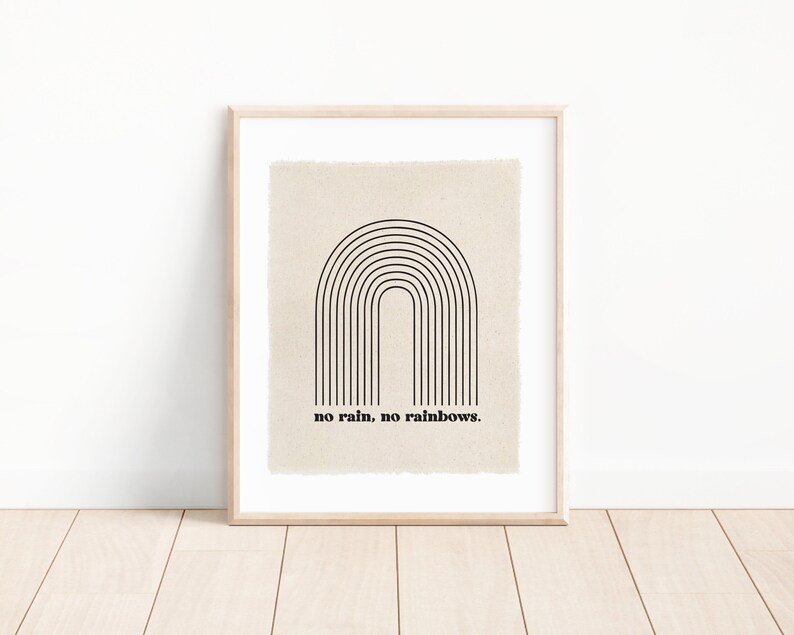 May include: A framed print with a black and white minimalist rainbow design and the text "no rain, no rainbows."