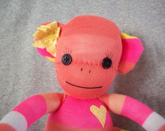 Sock monkey doll in peach and yellow stripes, Cora