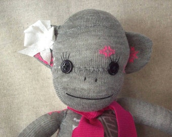 Sock monkey in grey with snowflakes, January