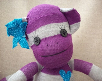 Sock monkey stuffed animal in purple and grey stripes, cute plushie made from socks, heirloom original sock monkey