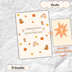 May include: A printable Kindle insert featuring a cream background with autumn-themed illustrations including orange pumpkins, brown teddy bears, sweaters, coffee cups, and maple leaves, with the text PUMPKIN SPICE and EVERYTHING NICE.