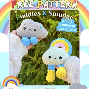 May include: Two crocheted cloud-shaped toys with smiling faces. One is gray with blue accents, the other is white with a rainbow and yellow boots. Text reads "FREE PATTERN" and "Puddles & Smudge".