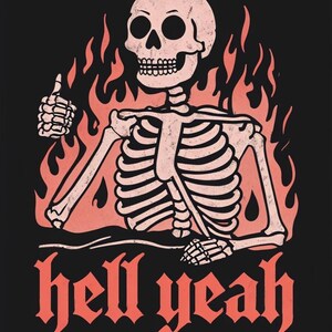 May include: A graphic illustration on a black background features a skeleton giving a thumbs up, surrounded by orange flames. The phrase "hell yeah" is written in a bold, gothic font below the skeleton. The skeleton is light pink.