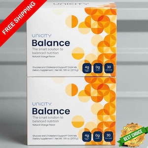 May include: Two white boxes of Unicity Balance dietary supplement. The boxes have orange and yellow geometric designs. Text on the boxes reads "Balance", "The smart solution to balanced nutrition", and "Natural Orange Flavor". Each box contains 30 stick packs.