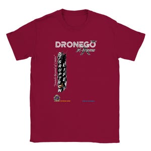 May include: A maroon t-shirt with a white graphic that reads "DRONEGO X-treme" above the word "DISRUPTION" in a vertical layout. The shirt also features the text "Sounds beyond of Limits" and other small graphics.