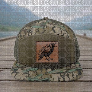 May include: A camouflage trucker hat with a mesh back and a flat brim. The front features a square patch with a black raven illustration and the text "F-CAW-F". The hat has a brown and green colour scheme.