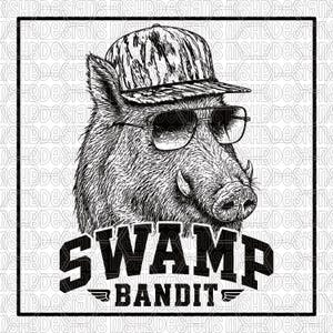 May include: Black and white illustration of a wild boar wearing sunglasses and a camouflage baseball cap. The text "SWAMP BANDIT" is displayed in bold, stylized letters below the boar's head, with a small wing design.