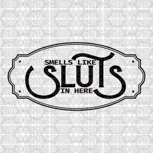 May include: Black and white sign with the text "Smells Like Sluts In Here" in a decorative oval frame. The text is in a bold, stylized font. The background is a repeating pattern of the text "MSHBDesigns".