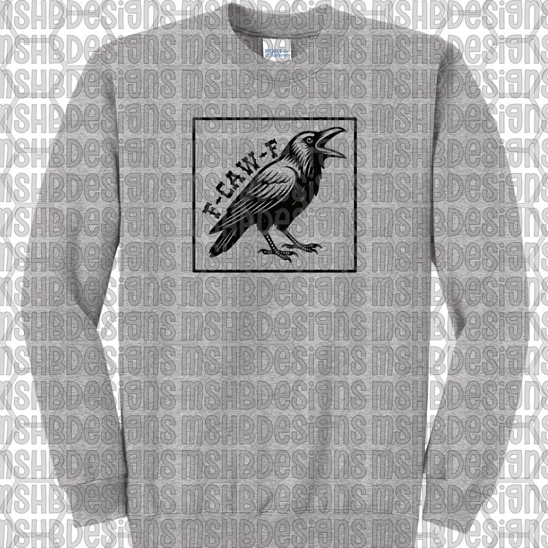 May include: A grey sweatshirt with a black raven design in a black square. The raven has an open beak, and the text "F-CAW-F" is above it. The sweatshirt has a crew neck and long sleeves, suitable for cooler weather.