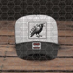 May include: A black and white baseball cap featuring a raven illustration and the text "F-CAW-F" within a square. The cap has a white front and a black peak. The cap has an "OTTO" label.