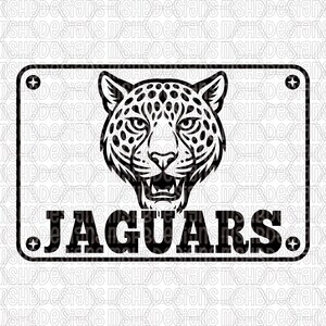 May include: Black and white graphic of a jaguar's head, centered on a rectangular sign. The word "JAGUARS" is printed in bold, capital letters below the jaguar. The sign has rounded corners and decorative elements.