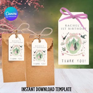 May include: Two brown paper gift bags with tags that read "Rachel's 1st Birthday" and "Thank You!". The tags feature a fairytale-themed design with a castle, a witch, and other magical elements. A third tag is shown with a pink ribbon.