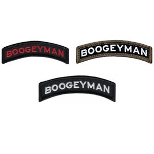 May include: Three curved embroidered patches, each bearing the word "BOOGEYMAN". One has red text on black, another white on black, and the third white on brown. Ideal for jackets or bags.