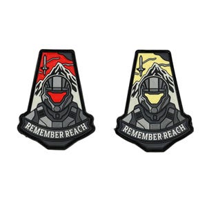May include: Two patches with a triangular design featuring a futuristic helmet and mountain scene. The text "REMEMBER REACH" is displayed on a banner below the helmet. One patch has a red and white color scheme, the other yellow and white.
