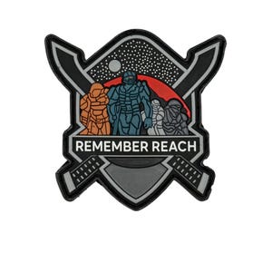 May include: A black, gray, and white patch with the text "REMEMBER REACH". The patch features a shield design with three figures in armor, a red mountain, and a starry sky. Two crossed swords are on either side of the shield.