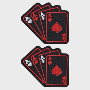 May include: Two sets of embroidered patches featuring playing cards. Each patch shows four Aces in a fanned arrangement. The cards are black with red borders and suit symbols. The Ace of Spades is prominently displayed.