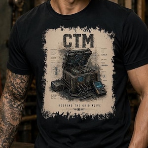 May include: Black t-shirt with a graphic featuring the letters "CTM" above an illustration of a technical device. The graphic is framed by a distressed border, and the text "KEEPING THE GRID ALIVE" is below the device.
