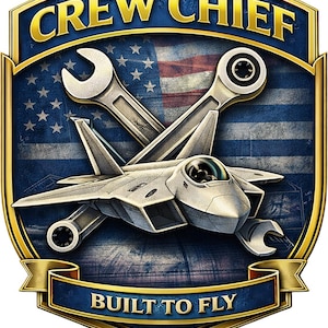 May include: A shield-shaped emblem featuring a silver fighter jet centered over a crossed wrench and ratchet. The background displays a blue and white American flag. The top banner reads CREW CHIEF and the bottom banner reads BUILT TO FLY.