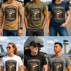 May include: A short-sleeve crew neck t-shirt featuring a graphic print of a C-5 aircraft with the text C-5 LOADMASTER RAMP OPERATIONS. The shirt is available in tan, olive green, navy blue, white, black, and heather gray, all with the same design.