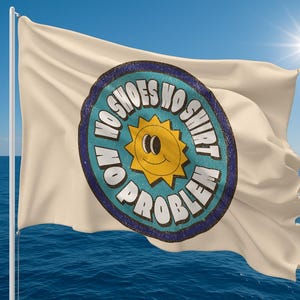 May include: A cream-colored flag with the text "NO SHOES NO SHIRT NO PROBLEM" in a circular design. The design features a smiling sun in the center. The flag is waving in front of a blue ocean and sky.
