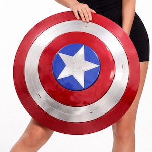 Captain America shield replica held by woman in black dress, Marvel superhero cosplay prop