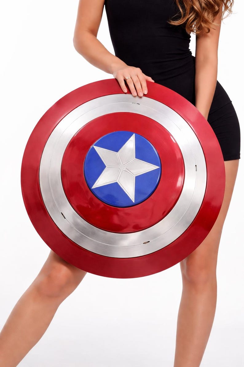 Captain America shield replica held by woman in black dress, Marvel superhero cosplay prop