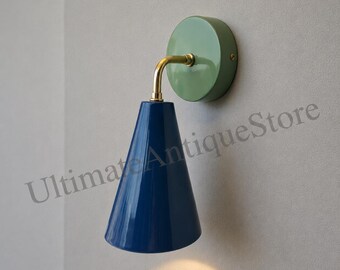 Modern wall sconce light with blue cone shade, brass arm, minimalist vintage fixture, Scandinavian design, bedroom, hallway, contemporary