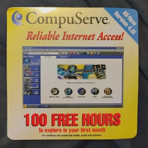 May include: A CompuServe advertisement with a yellow background. The text reads "CompuServe Reliable Internet Access!" and "100 FREE HOURS." The image shows a computer screen with the CompuServe interface.
