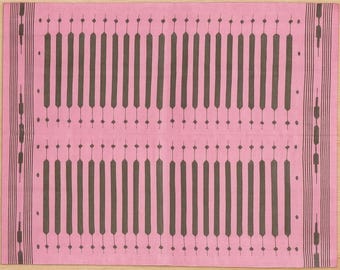 May include: A pink rectangular textile with a repeating pattern of dark brown vertical lines and small dots. The edges feature decorative vertical stripes. The textile is likely a rug or a decorative cloth.