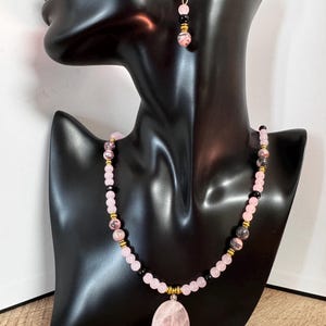 Rose quartz pendant necklace with  rhodonite beads and earrings.