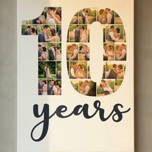 May include: A white canvas print featuring a collage of wedding photos arranged in the shape of the number 10. The word "years" is written in a black cursive font below the number. The photos show couples in various poses.