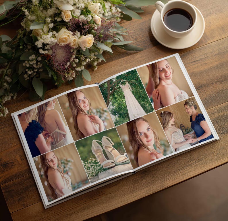 May include: An open photo album featuring a collage of wedding images, including a white dress, high-heeled sandals, and portraits of a person. The album is placed on a wooden surface next to a bouquet of white and purple flowers and a cup of coffee.