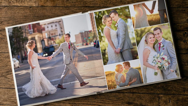 May include: A photo album open to a spread featuring multiple wedding photographs. The images display a couple in formal attire, including a white gown and a grey suit with a red tie, captured in various outdoor settings and urban locations.