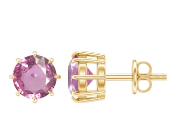 May include: A pair of stud earrings featuring round, light pink gemstones set in gold-colored metal. The earrings are shown on a white background, with one earring facing forward and the other turned to the side.