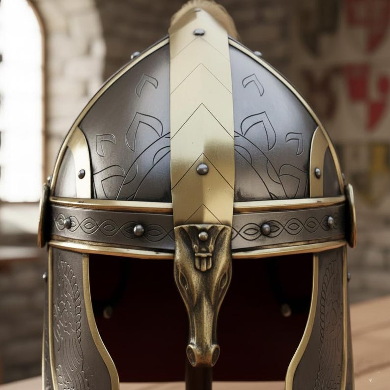 May include: A detailed close-up of a medieval helmet. The helmet is primarily silver with gold accents, including a central vertical band and decorative trim. The design features embossed patterns and a stylized horse head at the front, suggesting historical or fantasy themes.