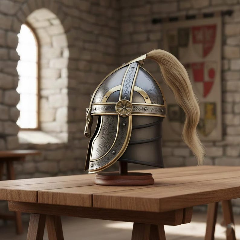 May include: A detailed, antique-style helmet with gold accents and a blonde ponytail. The helmet is displayed on a wooden stand, set against a backdrop of a stone wall and a wooden table. The design features intricate patterns and a classic aesthetic.