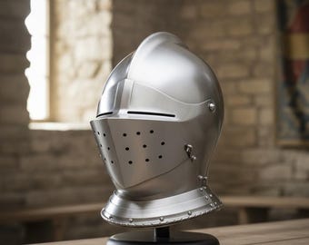 May include: A polished silver knight's helmet with a visor featuring small ventilation holes. The helmet is displayed on a black stand atop a wooden table. The background includes a brick wall and a window.