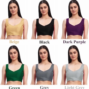 Puede incluir: Seis blusas sin mangas en varios colores: beige, negro, morado oscuro, verde, gris y gris claro. Cada blusa tiene un dise&ntilde;o de cuello en V. Los nombres de los colores se muestran debajo de cada blusa.