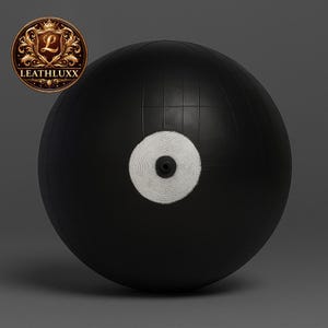 May include: A black exercise ball with a white circular target in the center. The ball is made of a durable material and is designed for various fitness activities. The Leathluxx logo is visible in the upper left corner.