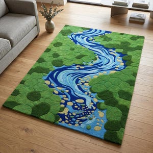 May include: A rectangular area rug with a nature-inspired design. The rug features a blue river winding through a green, textured landscape. The river's path is bordered by green, circular shapes, creating a unique, artistic floor covering.