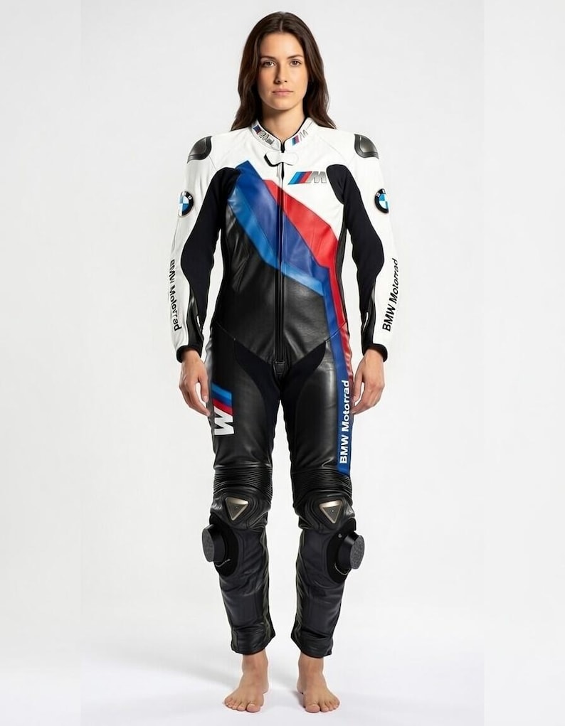 May include: A white, black, and blue BMW motorcycle racing suit. The suit features a white upper body with black sleeves and a black lower body. Blue and red stripes run down the front. The BMW logo is visible on the chest and sleeves.